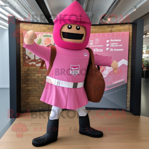 Pink British Royal Guard mascot costume character dressed with a Board Shorts and Backpacks
