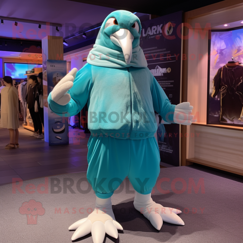 Turquoise Albatross mascot costume character dressed with a Joggers and Wraps