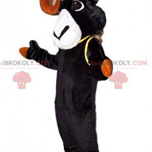 Mascota de íbice negro con hermosos cuernos marrones -