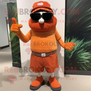 Rust Orange mascot costume character dressed with a Bermuda Shorts and Eyeglasses