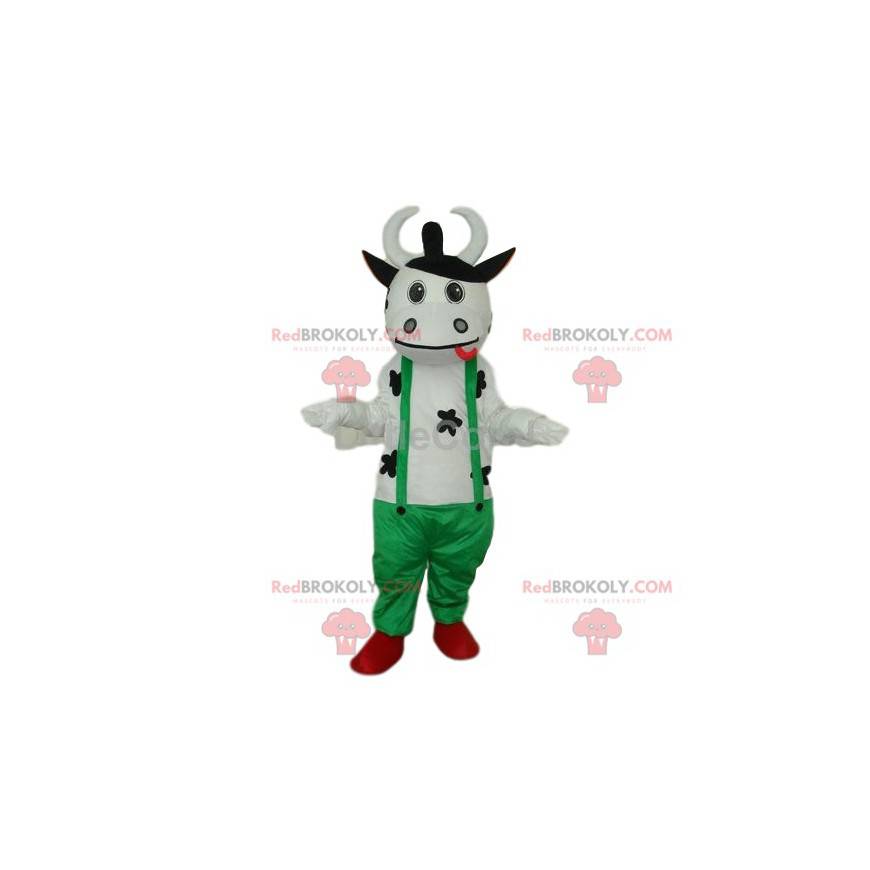 Mascotte de vache blanche sympathique, avec une salopette verte
