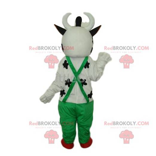 Mascotte de vache blanche sympathique, avec une salopette verte