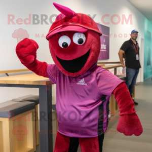 Magenta Lobster mascot costume character dressed with a Bermuda Shorts and Caps