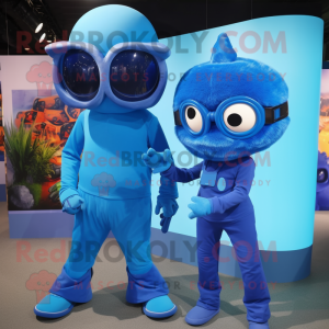 Blue Cyclops mascot costume character dressed with a Jumpsuit and Ties