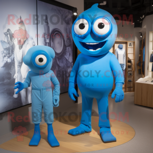 Blue Cyclops mascot costume character dressed with a Jumpsuit and Ties