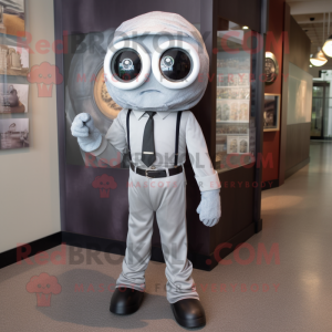 Silver Cyclops mascot costume character dressed with a Button-Up Shirt and Tie pins