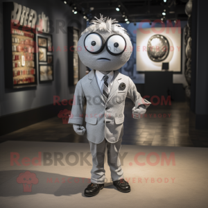 Silver Cyclops mascot costume character dressed with a Button-Up Shirt and Tie pins