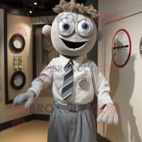 Silver Cyclops mascot costume character dressed with a Button-Up Shirt and Tie pins