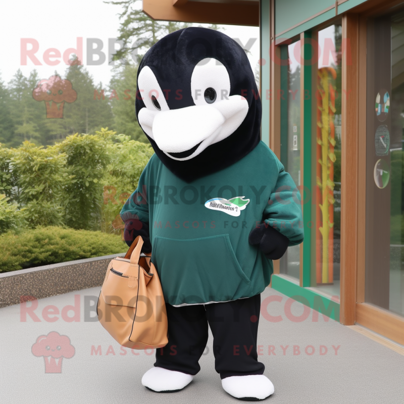 Forest Green Killer Whale mascot costume character dressed with a Hoodie and Tote bags Forest Green Killer Whale mascot costume character dressed with a Hoodie and Tote bags