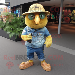 Gold Kiwi mascot costume character dressed with a Denim Shirt and Shoe clips