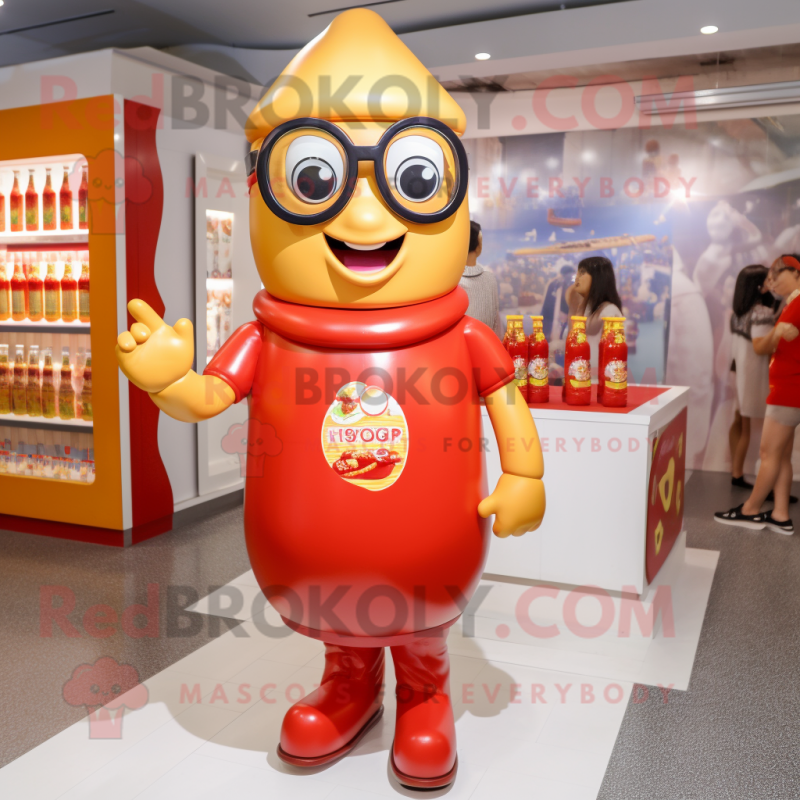 Gold Bottle Of Ketchup mascot costume character dressed with a Romper and Eyeglasses Gold Bottle Of Ketchup mascot costume character dressed with a Romper and Eyeglasses