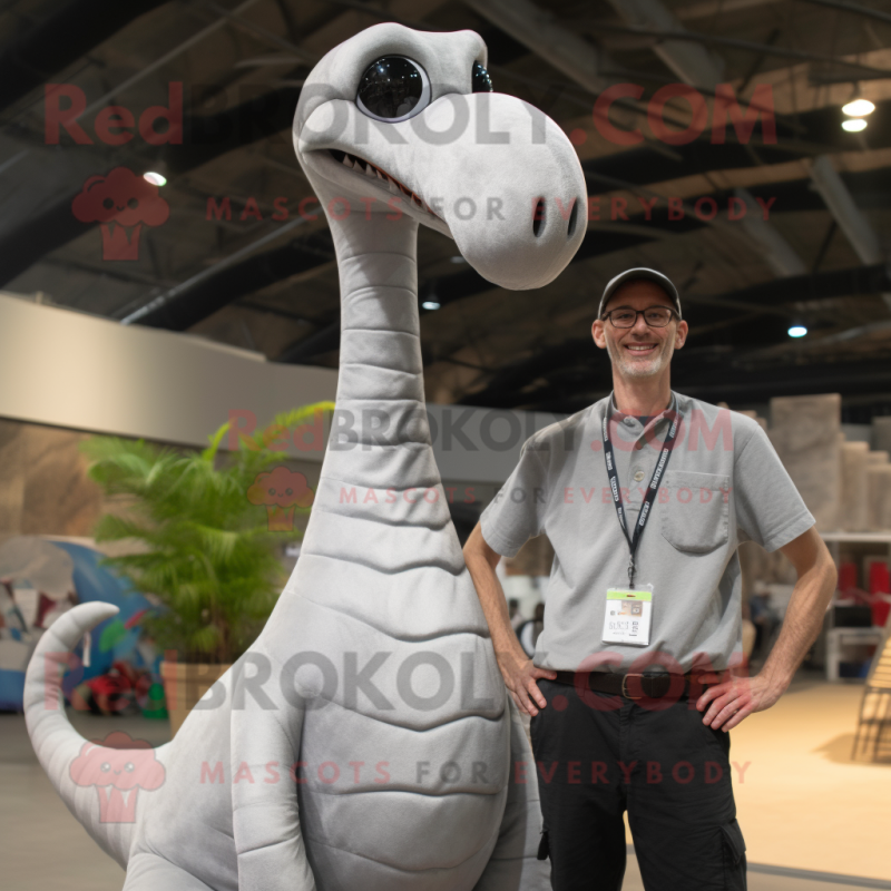 Silver Brachiosaurus mascot costume character dressed with a Henley Shirt and Suspenders Silver Brachiosaurus mascot costume character dressed with a Henley Shirt and Suspenders