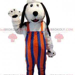 White dog mascot with orange and blue striped overalls. -