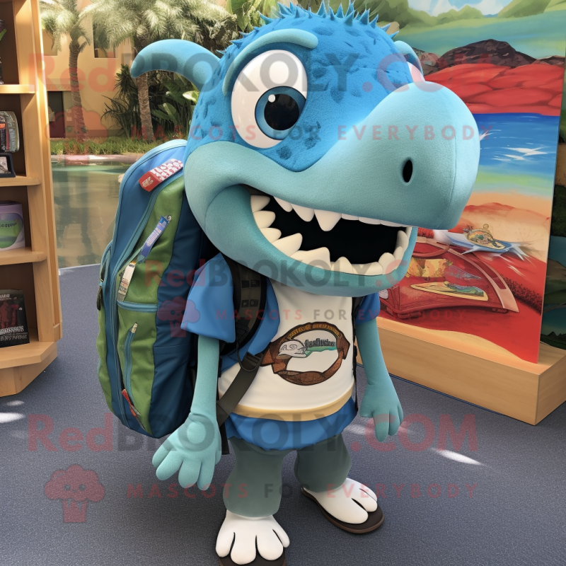 Turquoise Barracuda mascot costume character dressed with a Cardigan and Backpacks