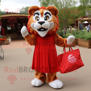 Red Saber-Toothed Tiger mascot costume character dressed with a Maxi Skirt and Tote bags