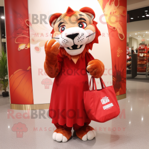 Red Saber-Toothed Tiger mascot costume character dressed with a Maxi Skirt and Tote bags