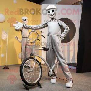 Silver Unicyclist mascot costume character dressed with a Jumpsuit and Ties