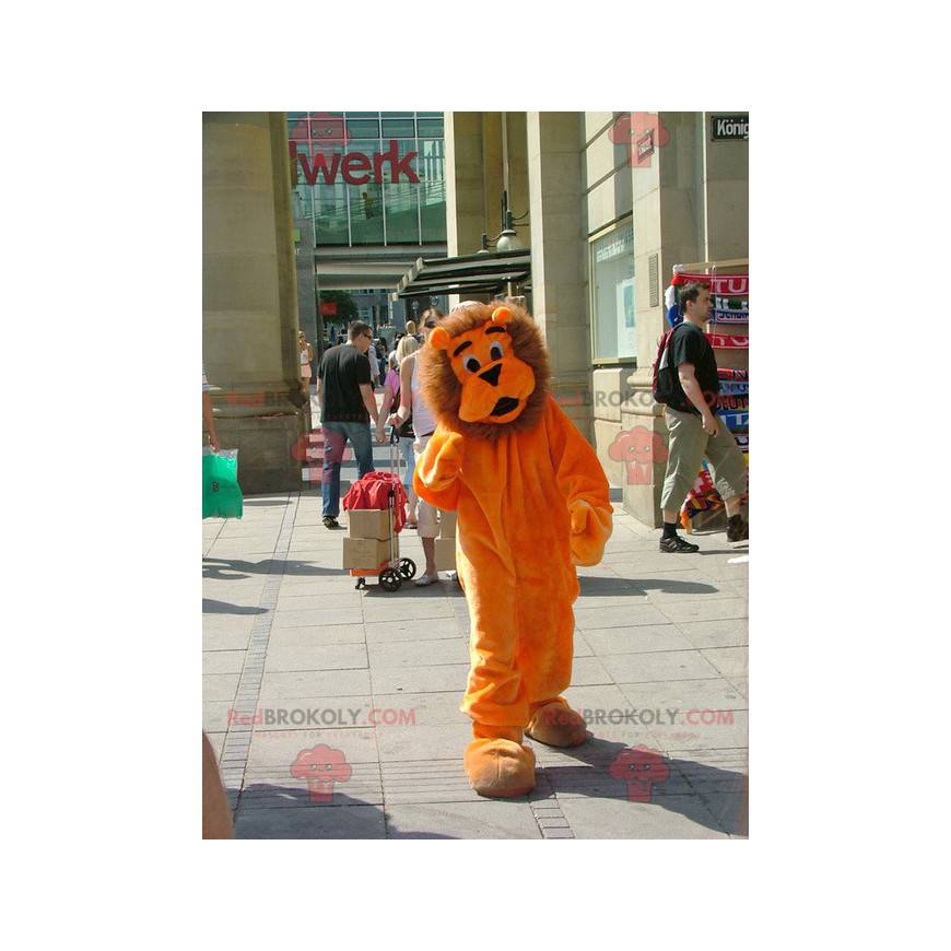 Mascotte de lion orange et marron mignon et tout poilu -
