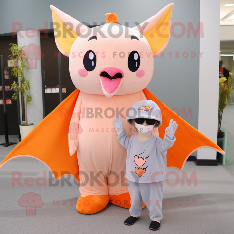 Peach Bat mascot costume character dressed with a Sheath Dress and Beanies Peach Bat mascot costume character dressed with a Sheath Dress and Beanies