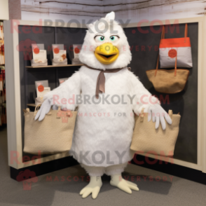 White Hens mascot costume character dressed with a Corduroy Pants and Tote bags