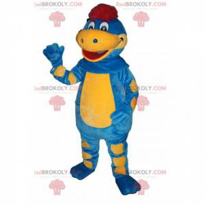 Mascota dinosaurio azul y amarillo con un soplo rojo -