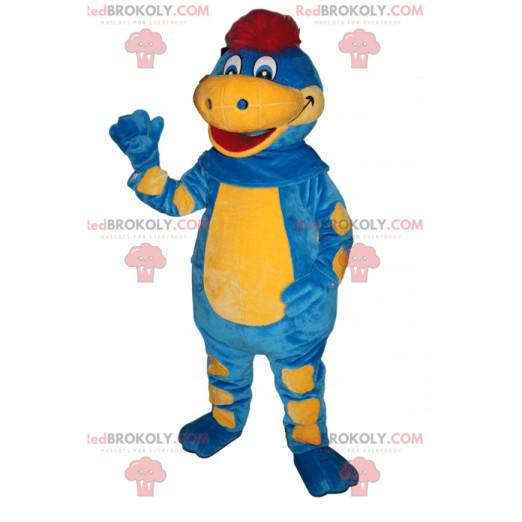 Mascote de dinossauro azul e amarelo com um puff vermelho -