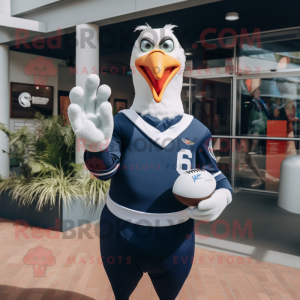 Navy Seagull mascot costume character dressed with a Rugby Shirt and Gloves