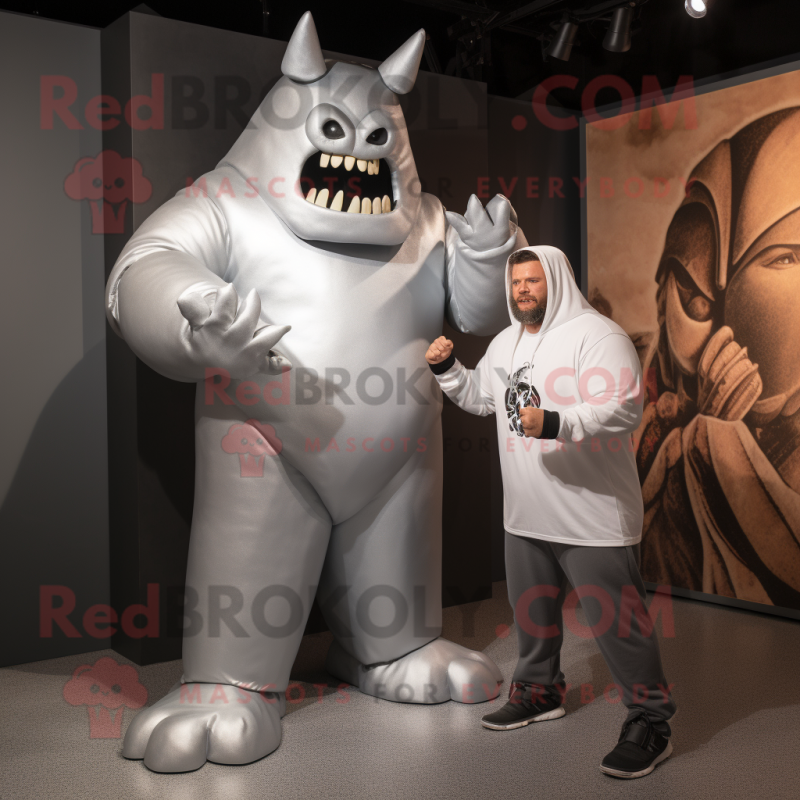 Silver Strongman mascot costume character dressed with a Hoodie and Watches Silver Strongman mascot costume character dressed with a Hoodie and Watches