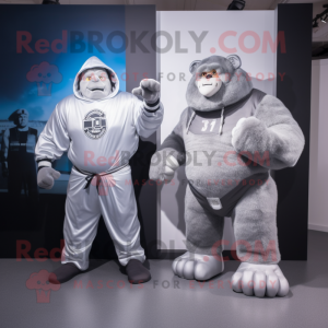 Silver Strongman mascot costume character dressed with a Hoodie and Watches