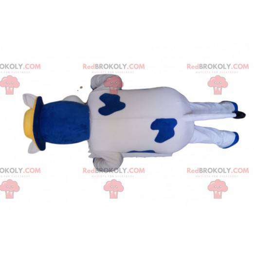 Mascote da vaca azul e branca com um chapéu amarelo -