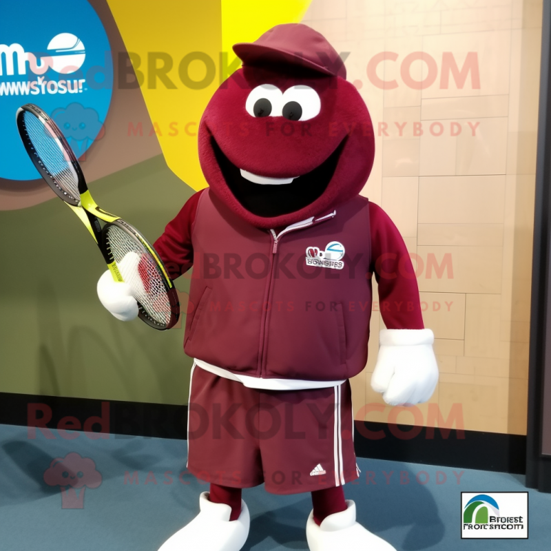 Maroon Tennis Racket mascot costume character dressed with a Sweatshirt and Shawl pins