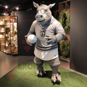 Gray Rhinoceros mascot costume character dressed with a Rugby Shirt and Cufflinks