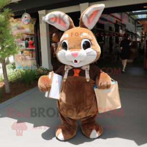 Brown Rabbit mascot costume character dressed with a Dress Shirt and Tote bags