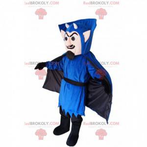 Mascote vampiro em traje azul, com pequenos chifres -