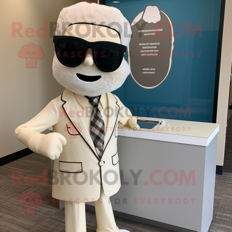 Cream Attorney mascot costume character dressed with a Graphic Tee and Sunglasses