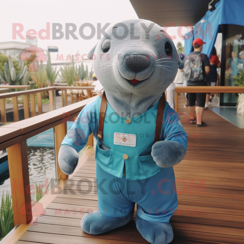 Cyan Sea Lion mascot costume character dressed with a Dungarees and Bow ties Cyan Sea Lion mascot costume character dressed with a Dungarees and Bow ties