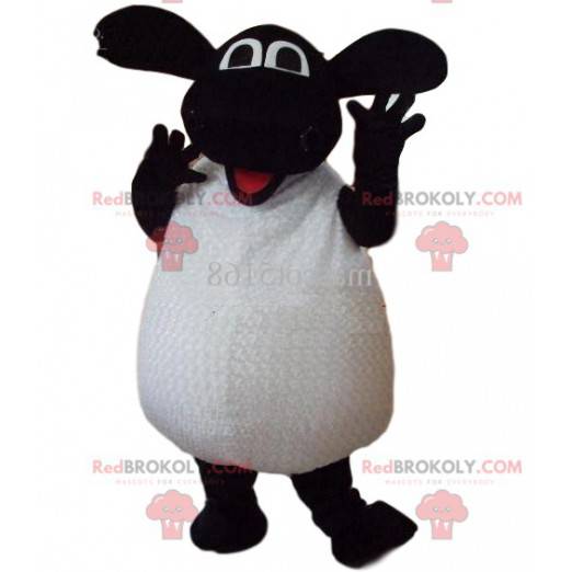 Mascotte di pecora bianca e nera molto entusiasta. -