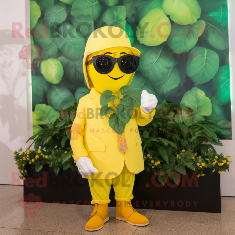 Yellow Spinach mascot costume character dressed with a Suit and Sunglasses