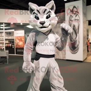 Silver Bobcat mascot costume character dressed with a Tank Top and Wraps