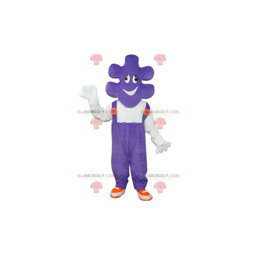 Mascotte de pièce de puzzle avec une salopette violette -