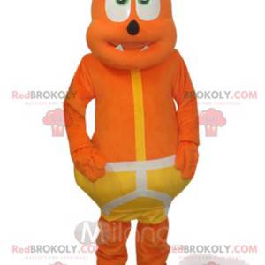Mascotte d'ours orange rigolo avec un costume jaune -