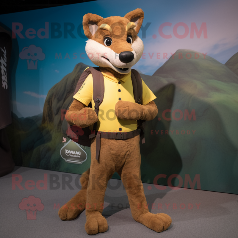 Brown Dingo mascot costume character dressed with a Capri Pants and Backpacks Brown Dingo mascot costume character dressed with a Capri Pants and Backpacks