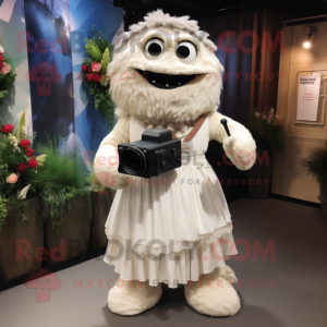 Beige Camera mascot costume character dressed with a Wedding Dress and Backpacks