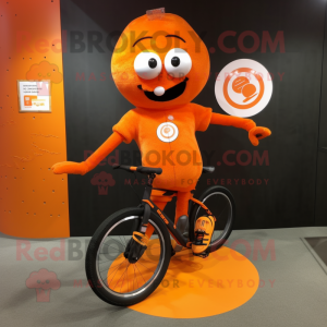 Orange Unicyclist mascot costume character dressed with a Running Shorts and Gloves