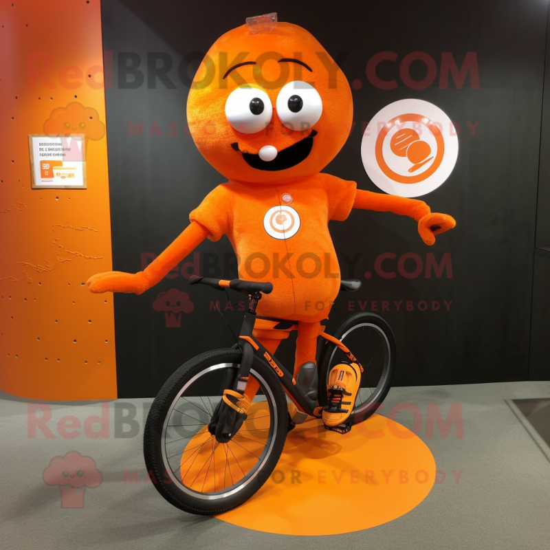 Orange Unicyclist mascot costume character dressed with a Running Shorts and Gloves Orange Unicyclist mascot costume character dressed with a Running Shorts and Gloves