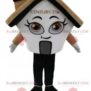 Mascote da casa branca e creme, com lareira - Redbrokoly.com