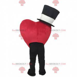 Mascota de corazón rojo sonriendo con un sombrero negro -