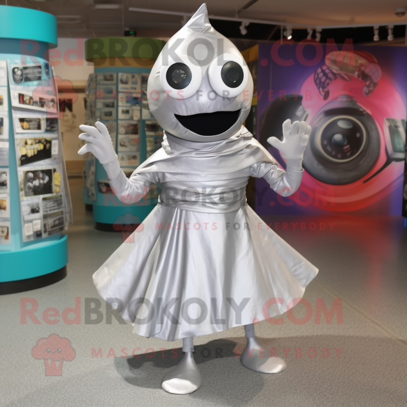 Silver Cyclops mascot costume character dressed with a Wrap Dress and Shoe laces Silver Cyclops mascot costume character dressed with a Wrap Dress and Shoe laces