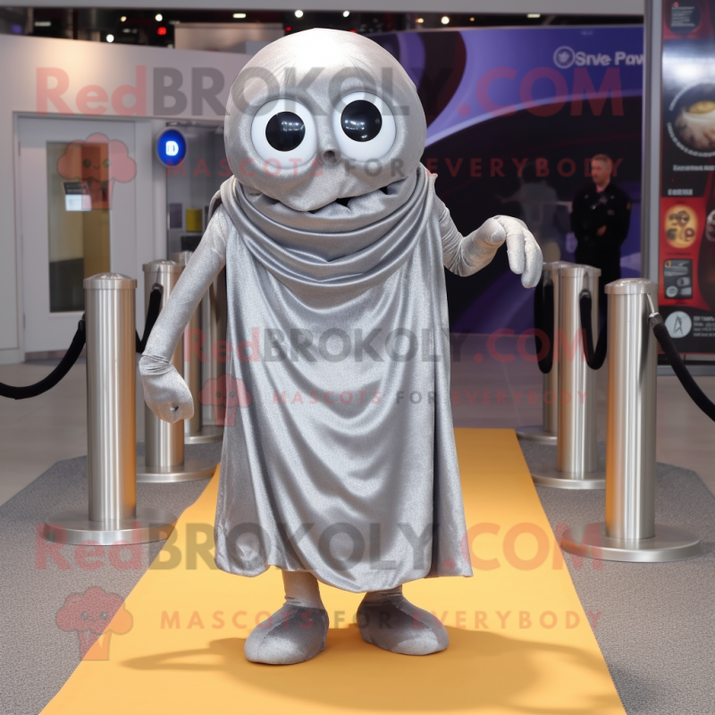 Silver Cyclops mascot costume character dressed with a Wrap Dress and Shoe laces