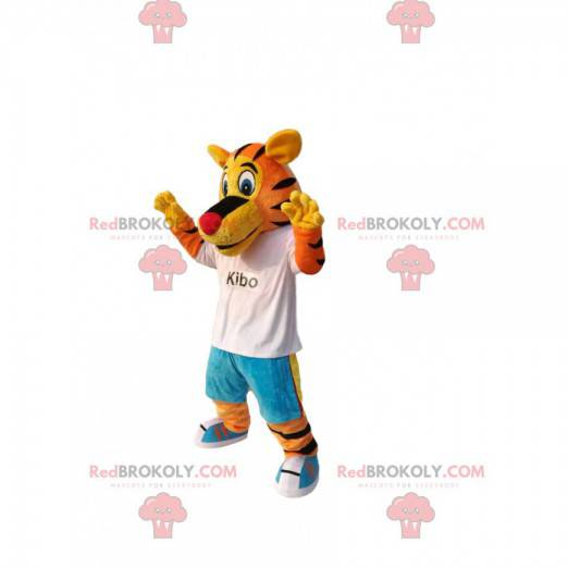 Mascota divertida del tigre, con jeans azules y una camiseta